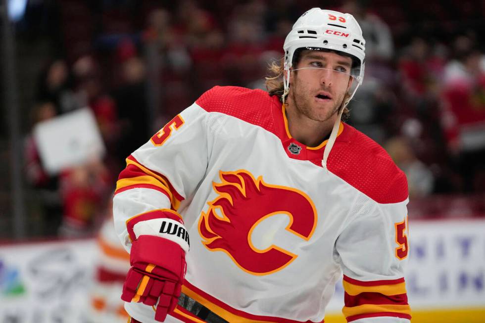 Calgary Flames defenseman Noah Hanifin warms up before an NHL hockey game against the Chicago B ...