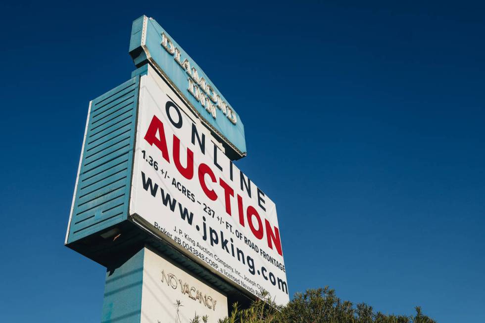 The sign for the Diamond Inn Motel is seen with an auction sign beneath it at the Diamond Inn M ...