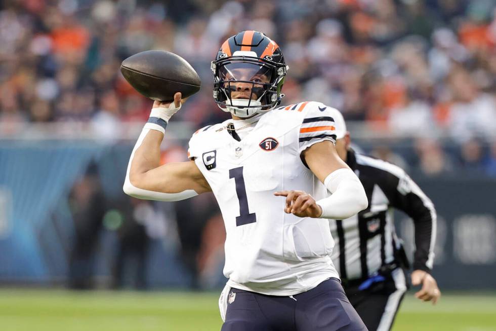 Chicago Bears quarterback Justin Fields (1) looks to pass the ball against the Arizona Cardinal ...