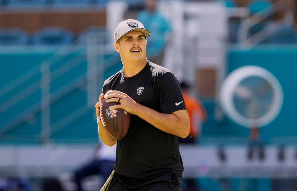 Raiders quarterback Aidan O'Connell warms up before an NFL game against the Miami Dolphins on S ...