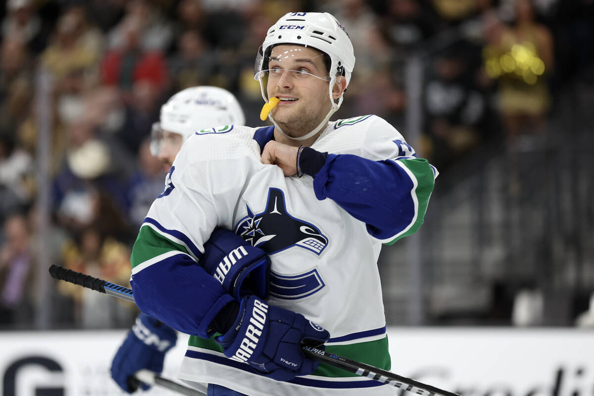 Canucks center Teddy Blueger (53), a former Golden Knight, smiles after his team attempted a go ...