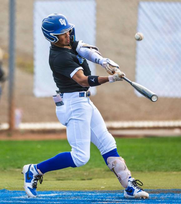 Green Valley batter Caden Kirby (12) sends a ball high and against Silverado during their NIAA ...