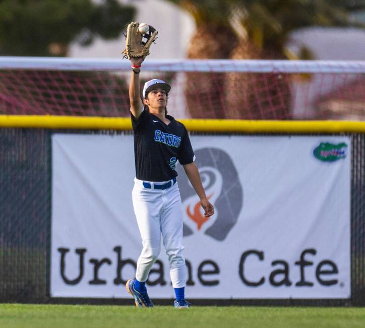 Green Valley outfielder Jared Orabuena (22) looks in a fly ball against Silverado during their ...