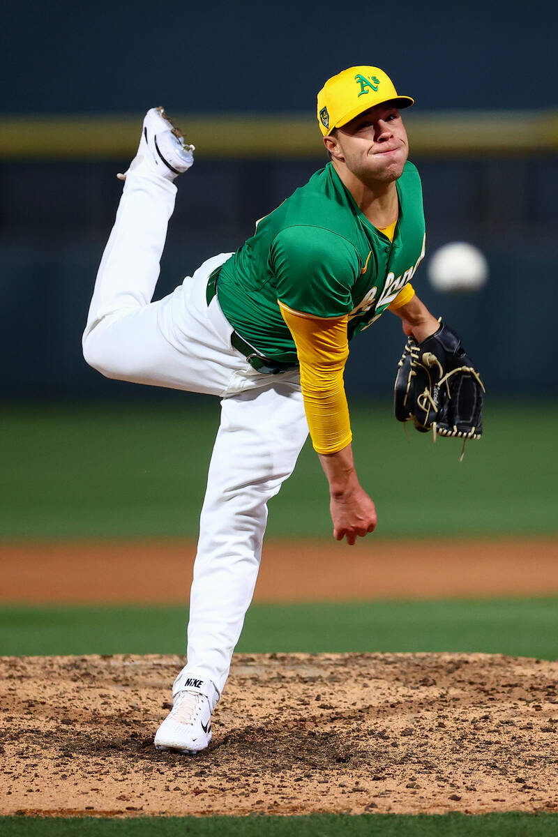 Oakland Athletics starting pitcher Mason Miller (19) throws to the Milwaukee Brewers during a M ...