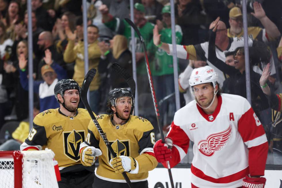 Golden Knights center Ivan Barbashev (49) and right wing Jonathan Marchessault (81) celebrate a ...