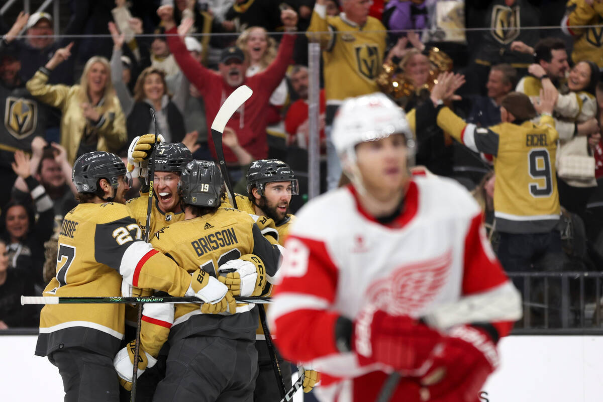 The Golden Knights rally around defenseman Brayden McNabb (3) after he scored a goal during the ...