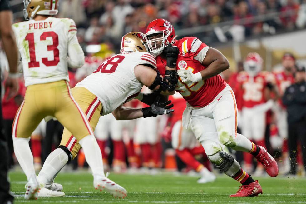 Kansas City Chiefs defensive tackle Chris Jones (95) tries to get past San Francisco 49ers offe ...