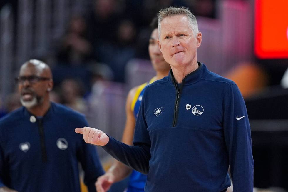 Golden State Warriors coach Steve Kerr gestures during the first half of the team's NBA basketb ...