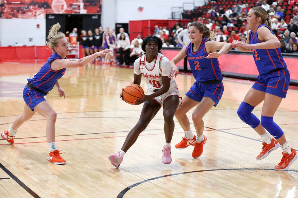 UNLV Lady Rebels guard Jasmyn Lott (10) drives toward the hoop against Boise State Broncos guar ...