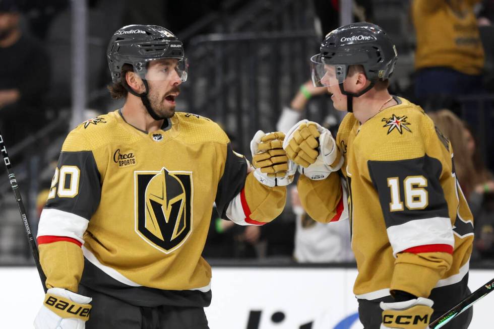 Golden Knights center Chandler Stephenson (20) and left wing Pavel Dorofeyev (16) celebrate Dor ...