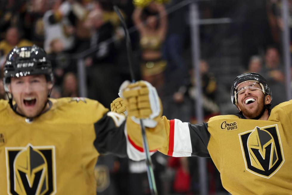 Golden Knights center Ivan Barbashev (49) and right wing Jonathan Marchessault (81) celebrate a ...