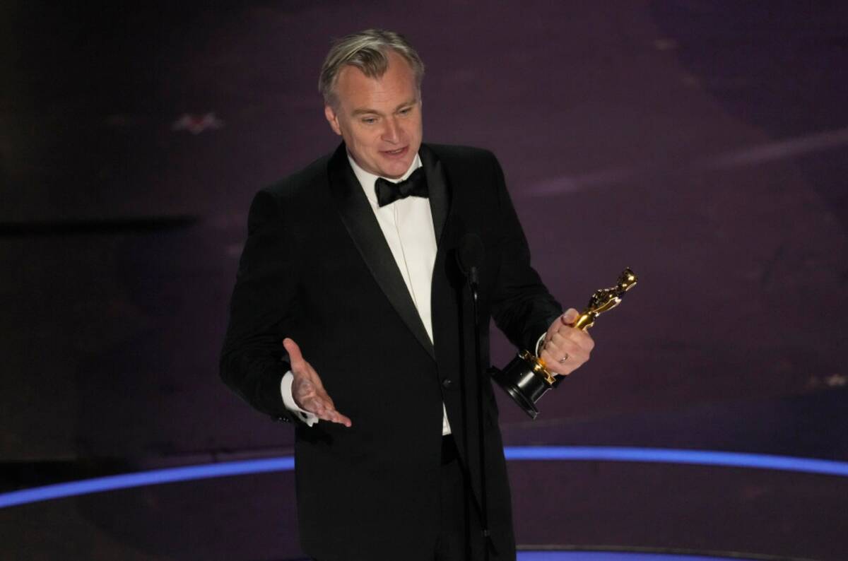 Christopher Nolan accepts the award for best director for "Oppenheimer" during the Oscars on Su ...