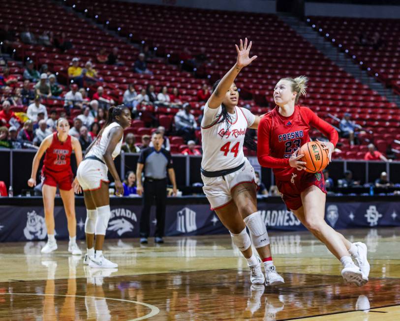 Fresno State’s forward Mia Jacobs (23) tries to get past UNLV’s forward Alyssa Br ...