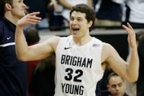 BYU's Jimmer Fredette celebrates after scoring 52 points against UNM during the Mountain West C ...