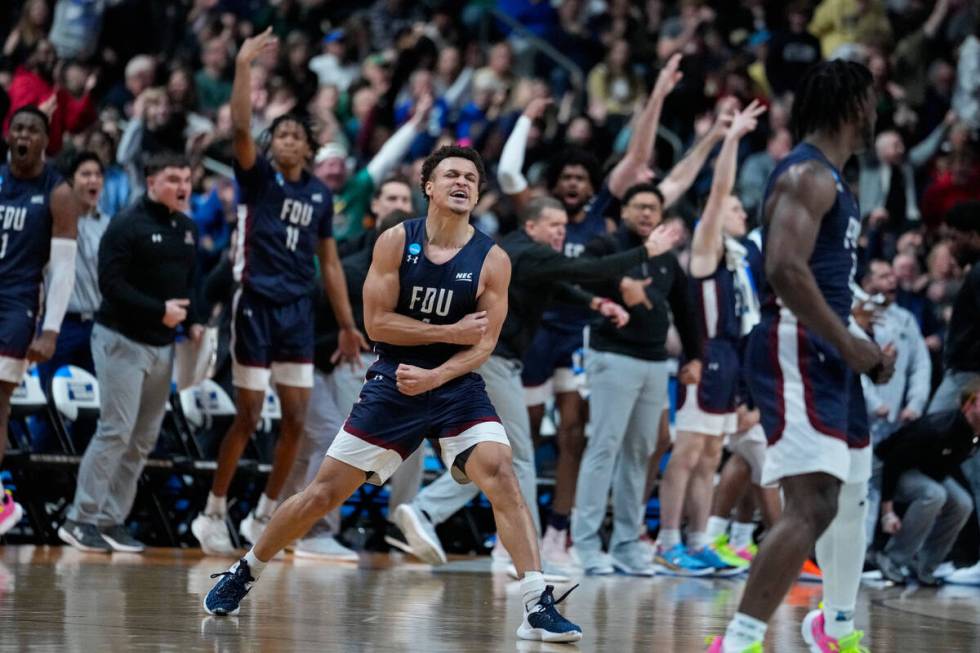 FILE - Fairleigh Dickinson guard Grant Singleton (4) celebrates after a basket against Purdue i ...