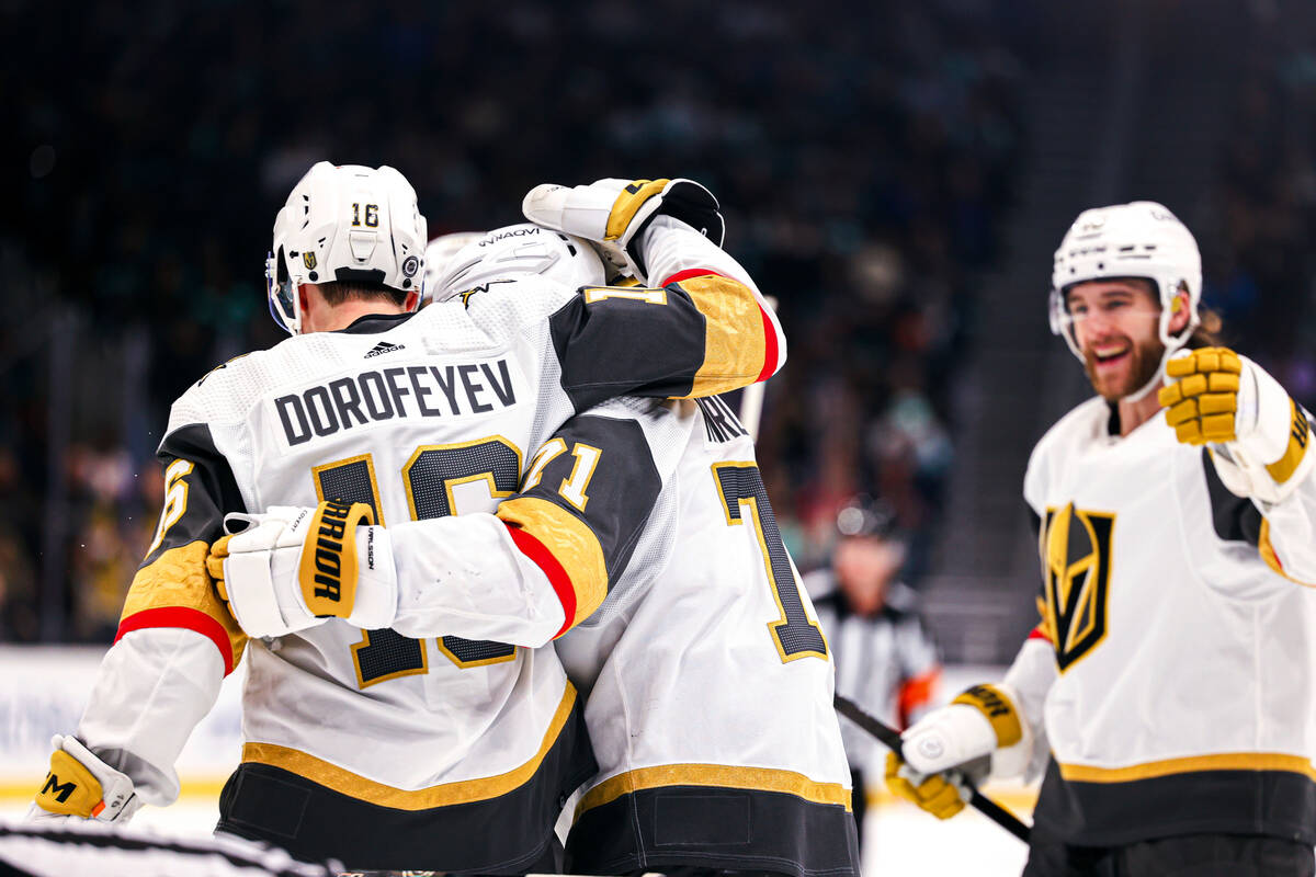 Vegas Golden Knights left wing Pavel Dorofeyev, left, celebrates after scoring a goal with cent ...