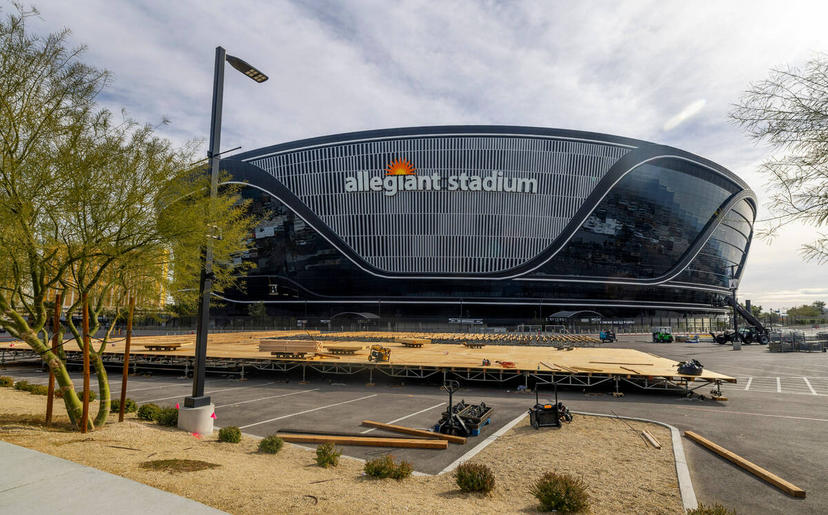A platform is constructed in a parking lot as Super Bowl preparations continue at Allegiant Sta ...