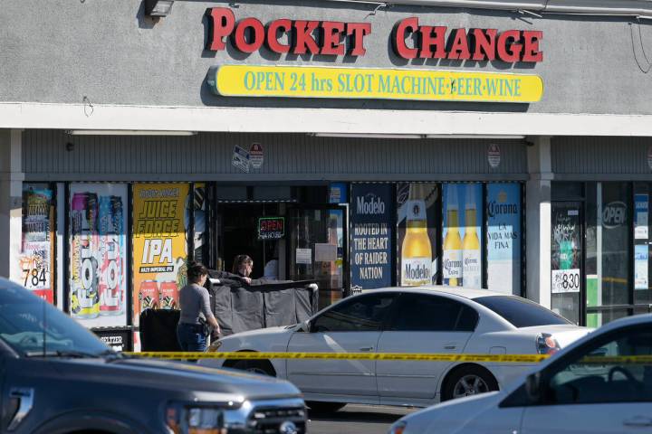 Metro investigators shield the body of a shooting victim Tuesday, March 5, 2024, at Tropicana A ...