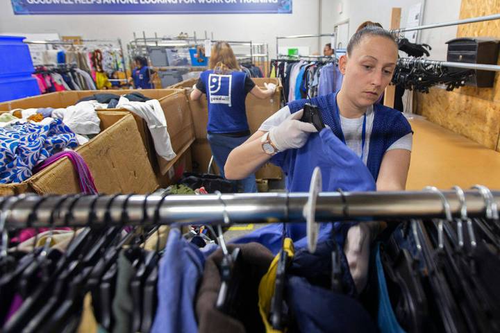 Katie Silber sorts donated clothing at Goodwill of Southern Nevada on Wednesday, Jan. 29, 2020, ...
