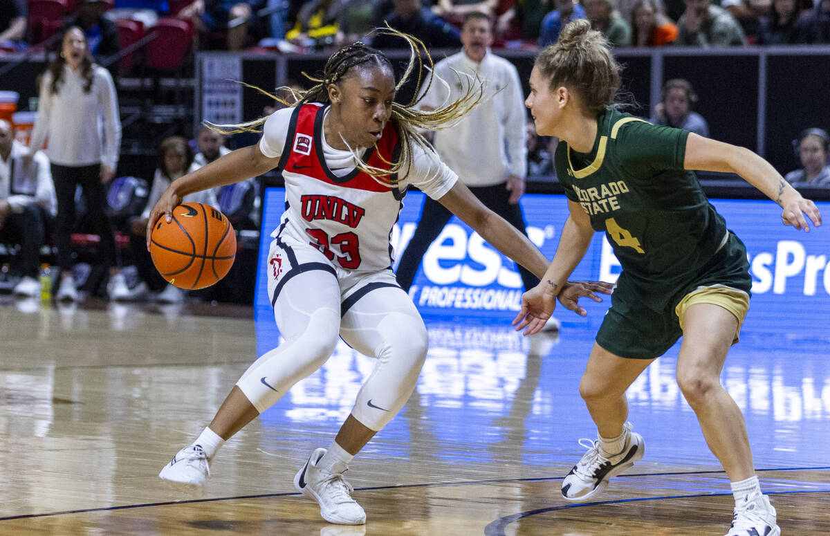 UNLV Lady Rebels guard Amarachi Kimpson (33) battles for the lane against Colorado State Rams g ...