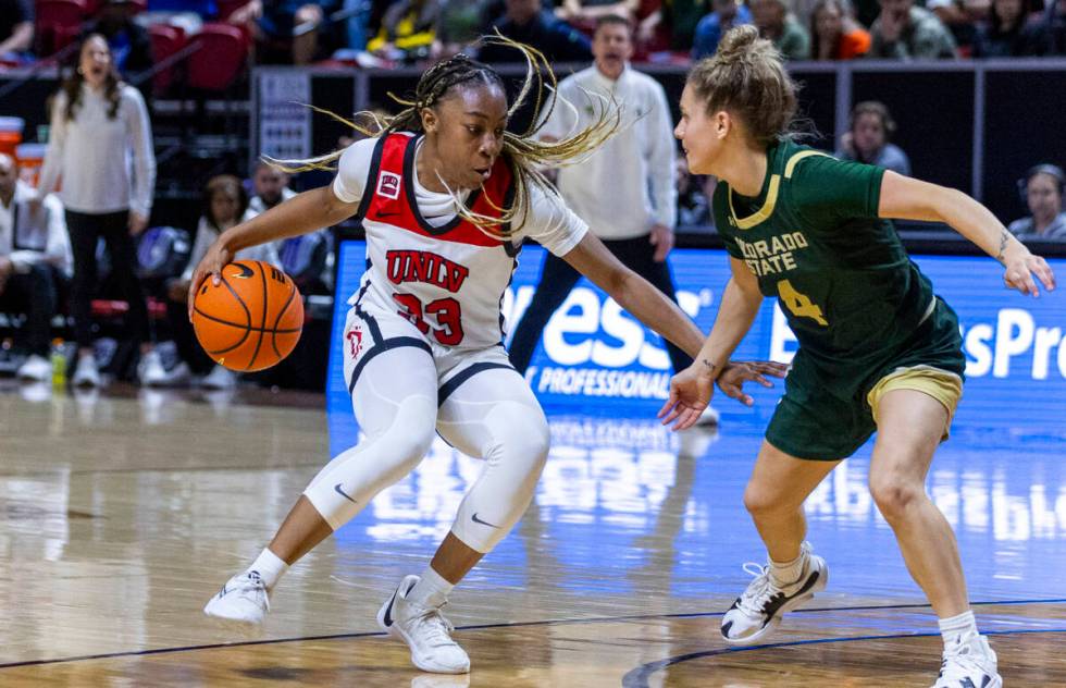 UNLV Lady Rebels guard Amarachi Kimpson (33) battles for the lane against Colorado State Rams g ...