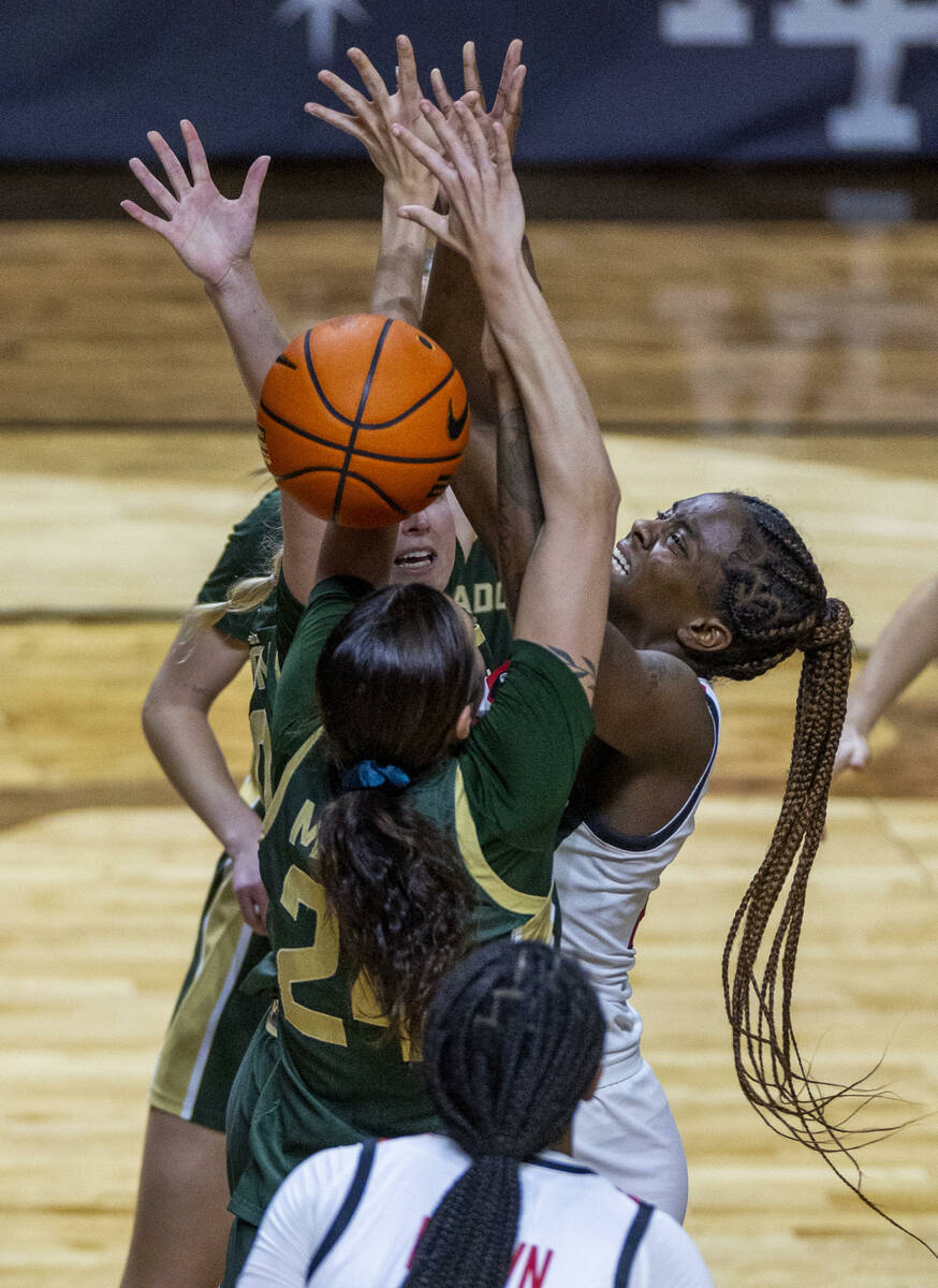 UNLV Lady Rebels center Desi-Rae Young (23) battles for a rebound under the basket against Colo ...