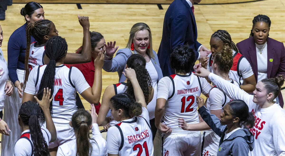 UNLV Lady Rebels head coach Lindy La Rocque and her players on a timeout against the Colorado S ...
