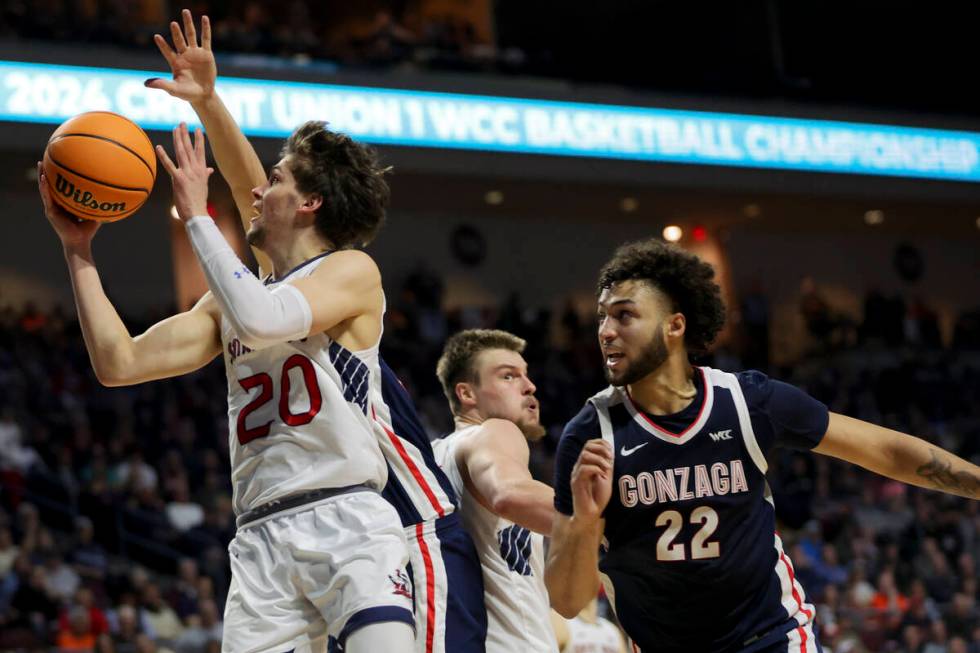 St. Mary's Gaels guard Aidan Mahaney (20) shoots while Gonzaga Bulldogs forward Anton Watson (2 ...