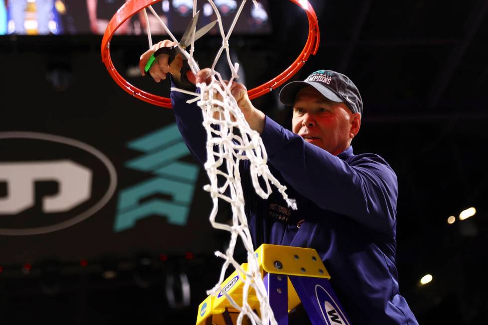 St. Mary's Gaels head coach Randy Bennett cuts the net after his team won an NCAA college baske ...