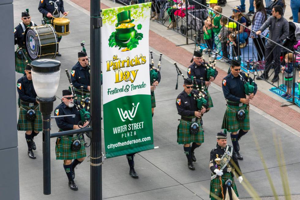 Members of the Las Vegas Emerald Society Pipes and Drums Band play in the parade down Water Str ...