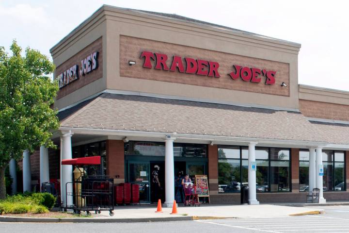 A shopper pushes a cart from the Trader Joe's supermarket on July 28, 2022, in Hadley, Mass. Tr ...