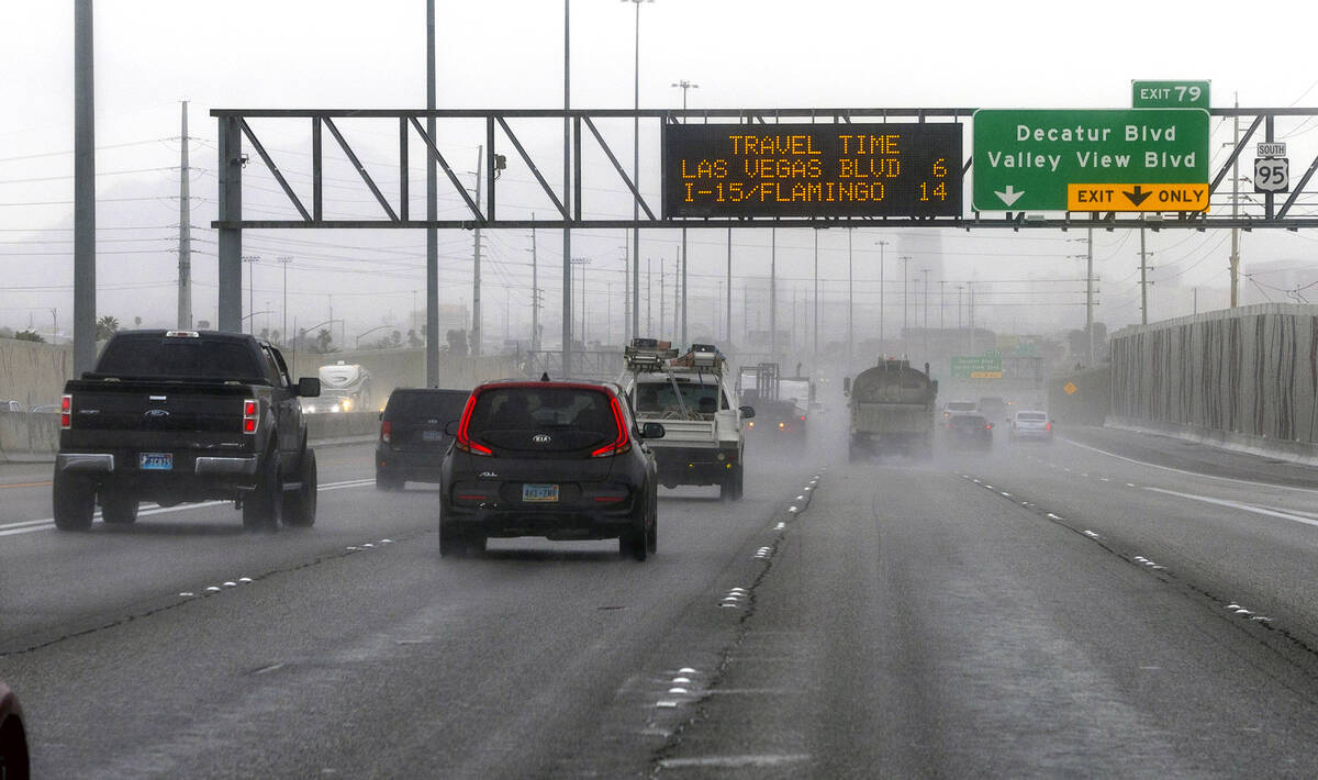 Traffic sprays up water on the road while traveling on the 95 South during a rainy day on Frida ...