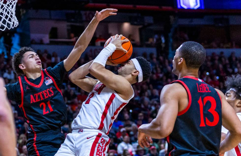 UNLV Rebels guard Justin Webster (2) has the ball pushed back into his face by San Diego State ...