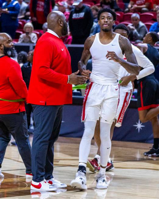 UNLV Rebels forward Kalib Boone (10) walks gingerly on an injured ankle as he attempts to warm ...