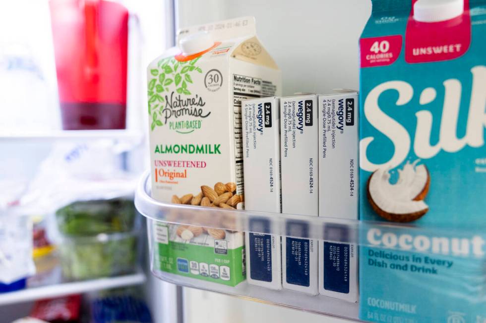 Doses of Wegovy, a drug used for weight loss, are stored in a refrigerator at Donna Cooper's ho ...