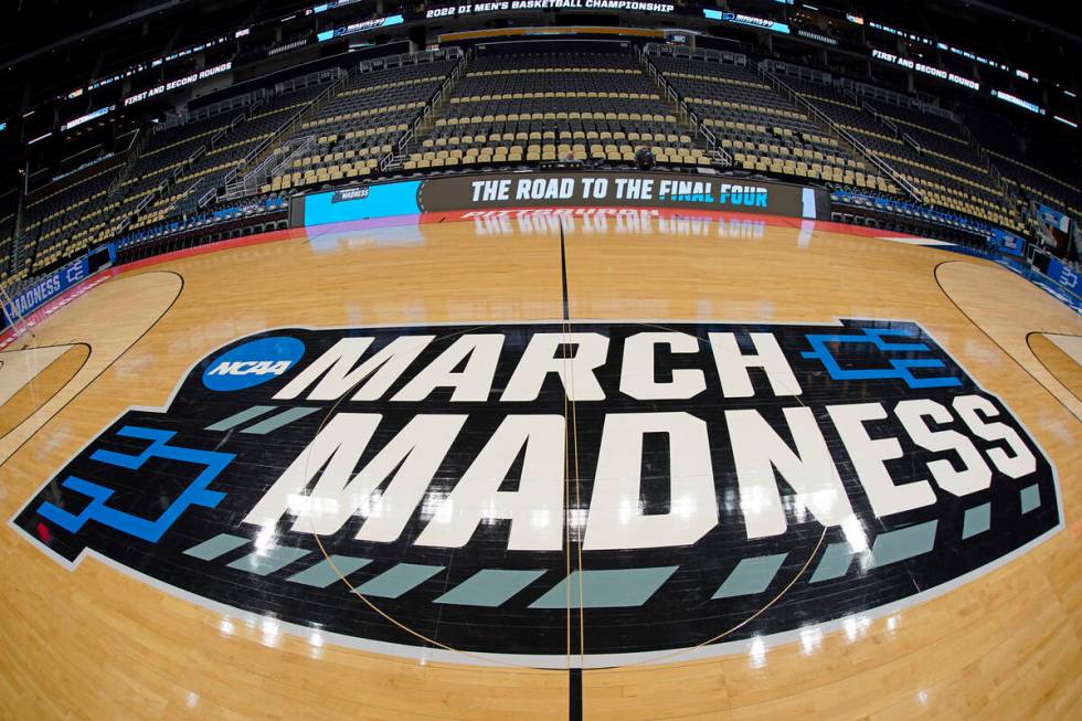 The basketball court at PPG Paints Arena in Pittsburgh is prepared on Thursday, March 17, 2022, ...