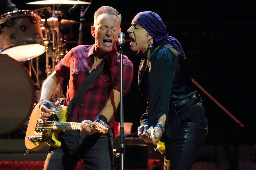 Bruce Springsteen, left, and Stevie Van Zandt, right, sing during a concert of Bruce Springstee ...