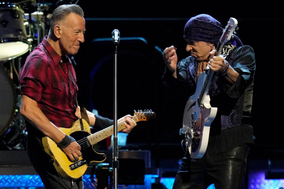 Bruce Springsteen, left, and Stevie Van Zandt, right, play their guitars on stage during his co ...