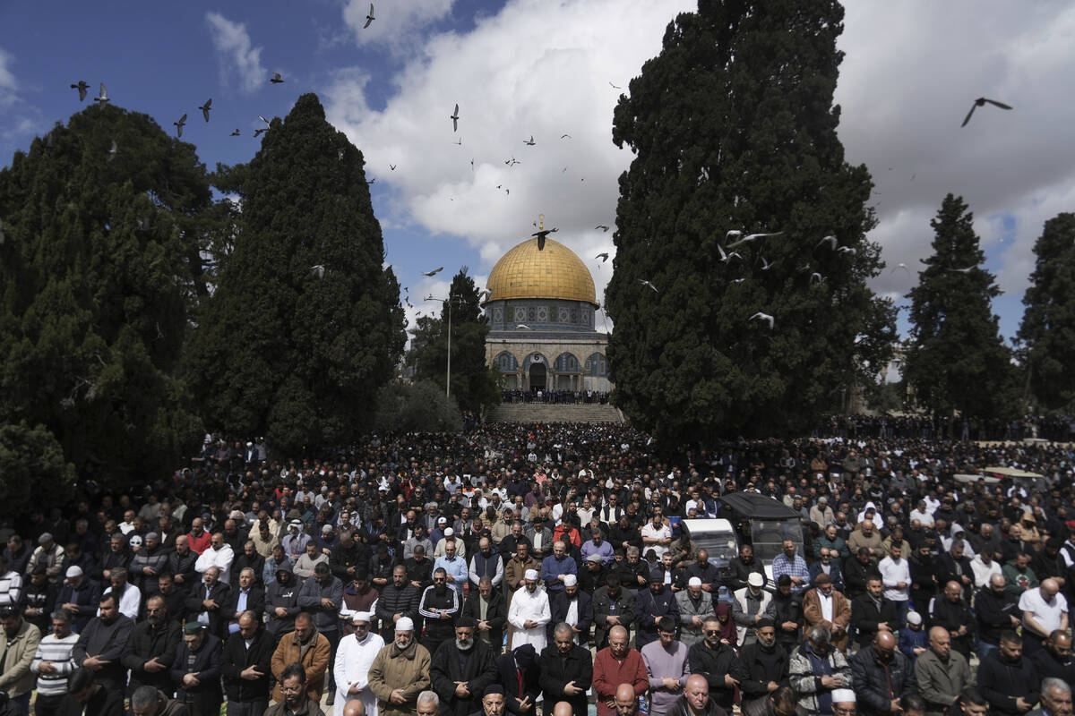 Muslim worshippers perform Friday prayers at the Al-Aqsa Mosque compound in the Old City of Jer ...