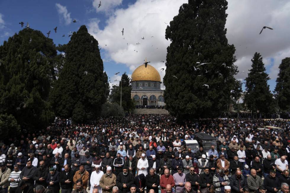 Muslim worshippers perform Friday prayers at the Al-Aqsa Mosque compound in the Old City of Jer ...