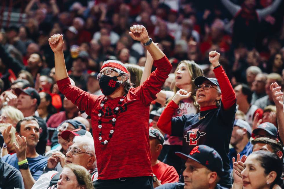 San Diego State fans cheer during a game against Utah State during the Mountain West tournament ...