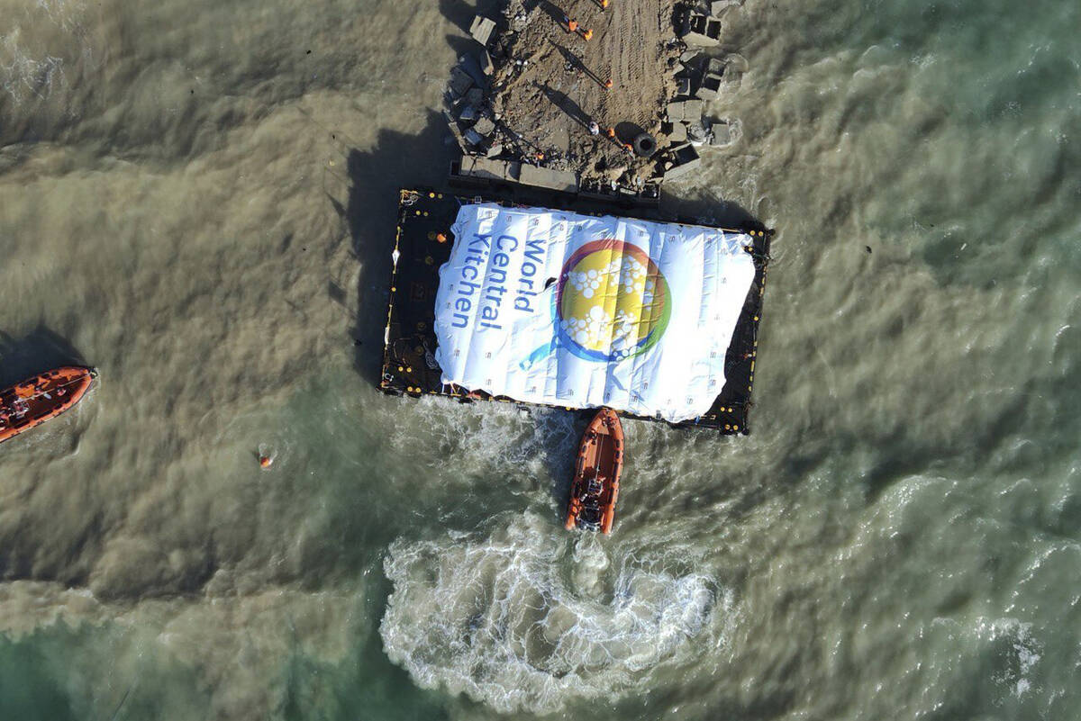 In this photo provided by the Israeli Army, humanitarian aid transported from a ship from the W ...