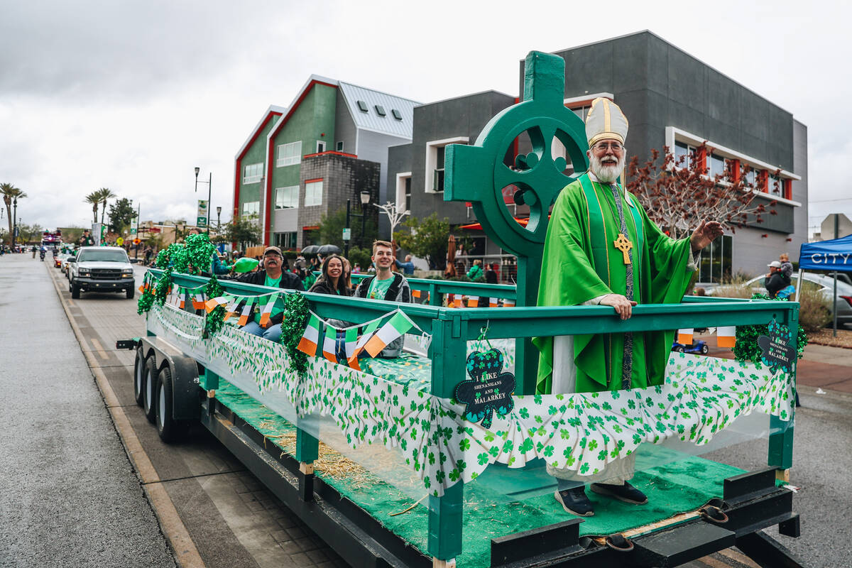 Saint Patrick waves to parade attendees during the St. Patrick’s Day parade on Water Str ...