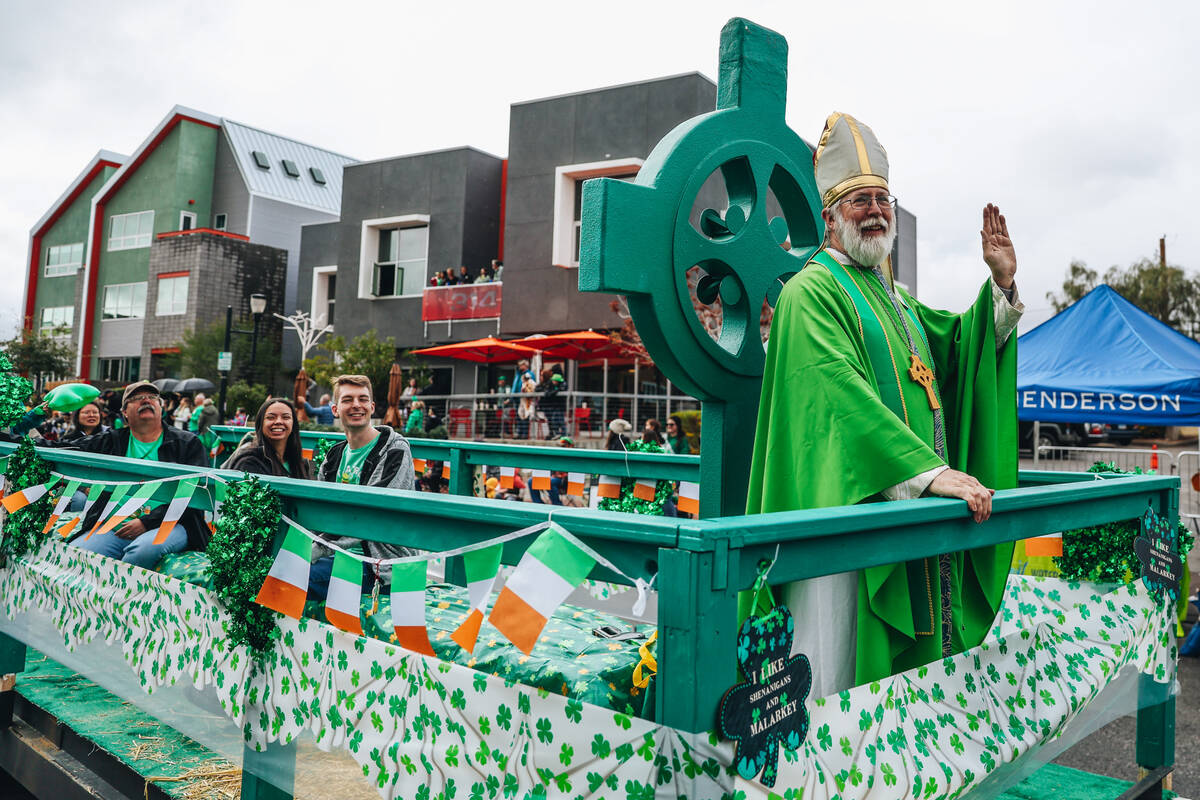 Saint Patrick waves to parade attendees during the St. Patrick’s Day parade on Water Str ...