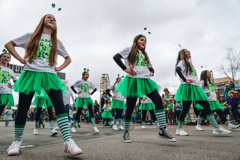 A dance group makes their way down the parade route during the St. Patrick’s Day parade ...