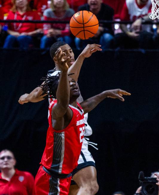 San Diego State Aztecs forward Jaedon LeDee (13) tips the ball away from New Mexico Lobos cente ...