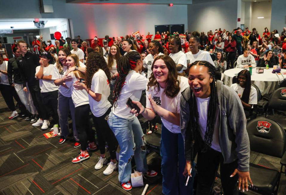 Members of the UNLV Lady Rebels basketball team cheer after their placement was announced in th ...