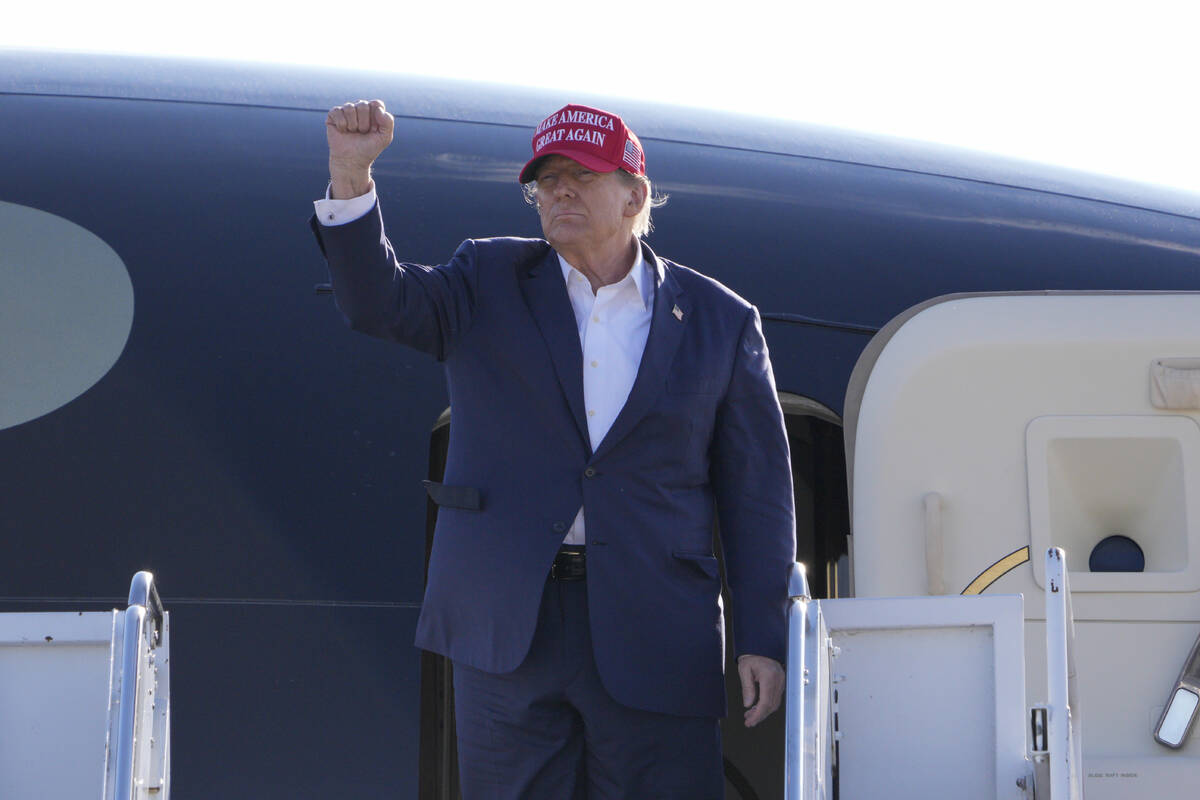 Republican presidential candidate former President Donald Trump gestures towards the crowd at a ...