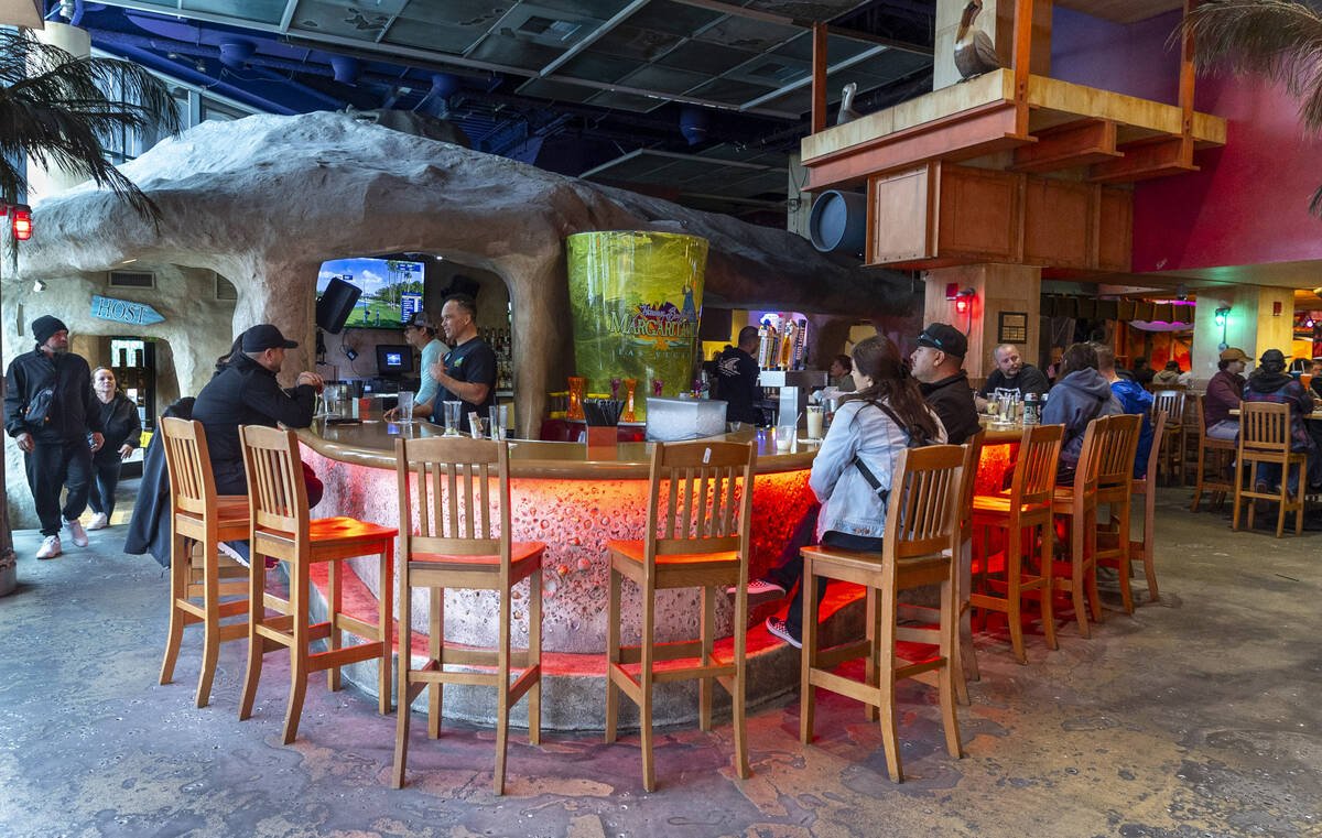 Guests at a bar within Margaritaville off the Strip on Friday, March 15, 2024, in Las Vegas. (L ...
