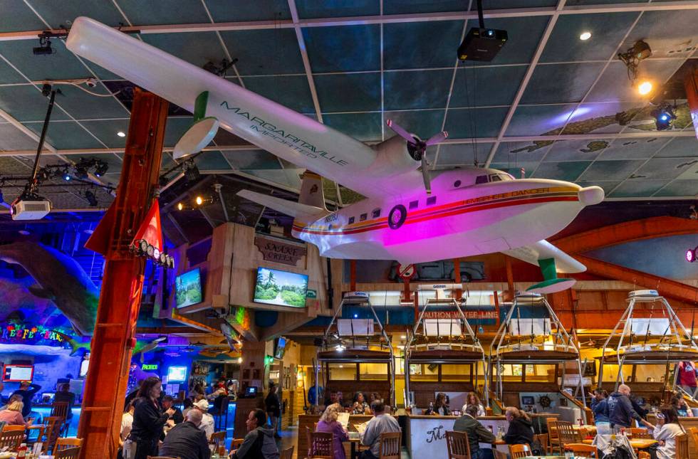 Guests dine and drink at a bar within Margaritaville off the Strip on Friday, March 15, 2024, i ...